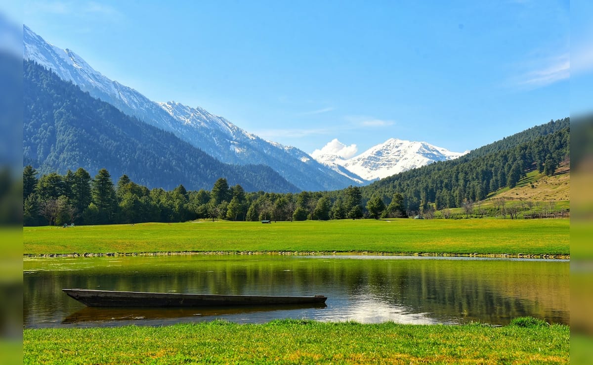 Green alpine meadow and lake with snow-capped Himalayan peaks — Kashmir Budget Group Tour